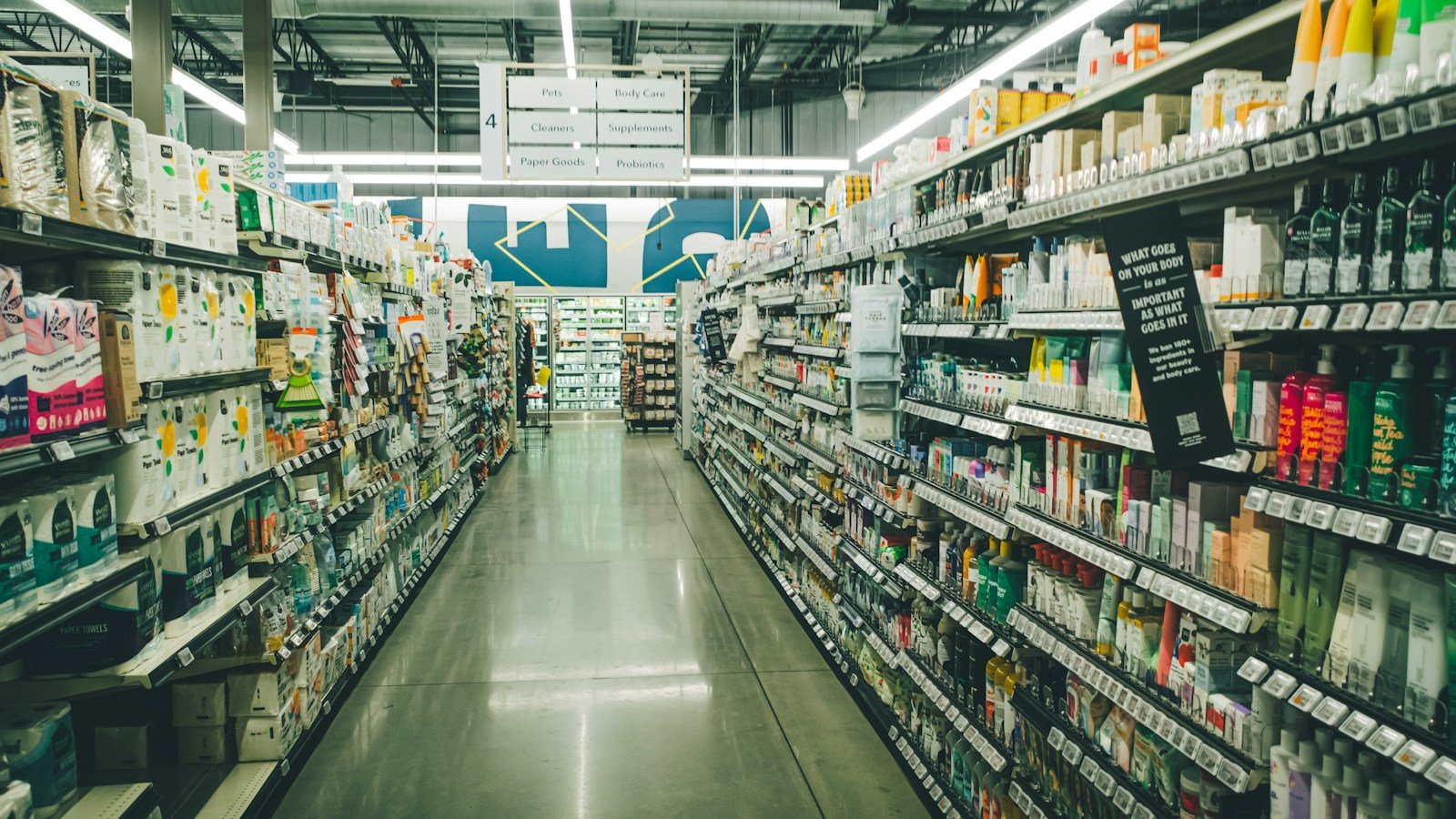 Grocery store aisle lined with products