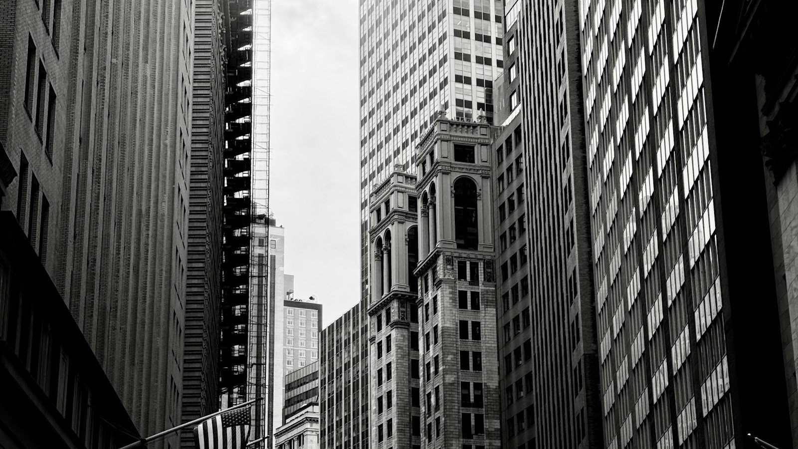 Black-and-white photograph of tall buildings near the New York Stock Exchange